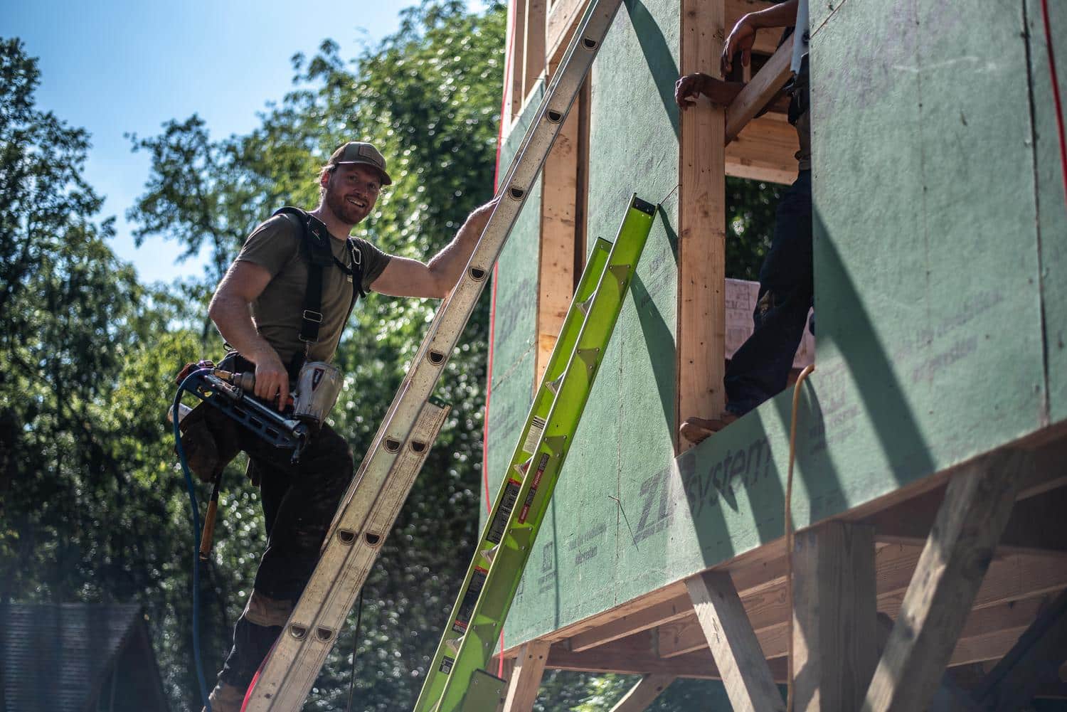 Framing crew at work on a new home structure, Asheville, North Carolina.